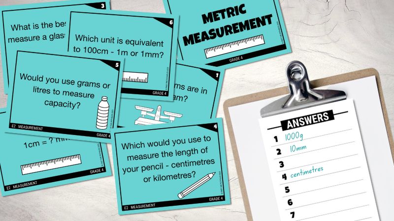 Collection of Measurement task cards on a desk with a student answer sheet.
